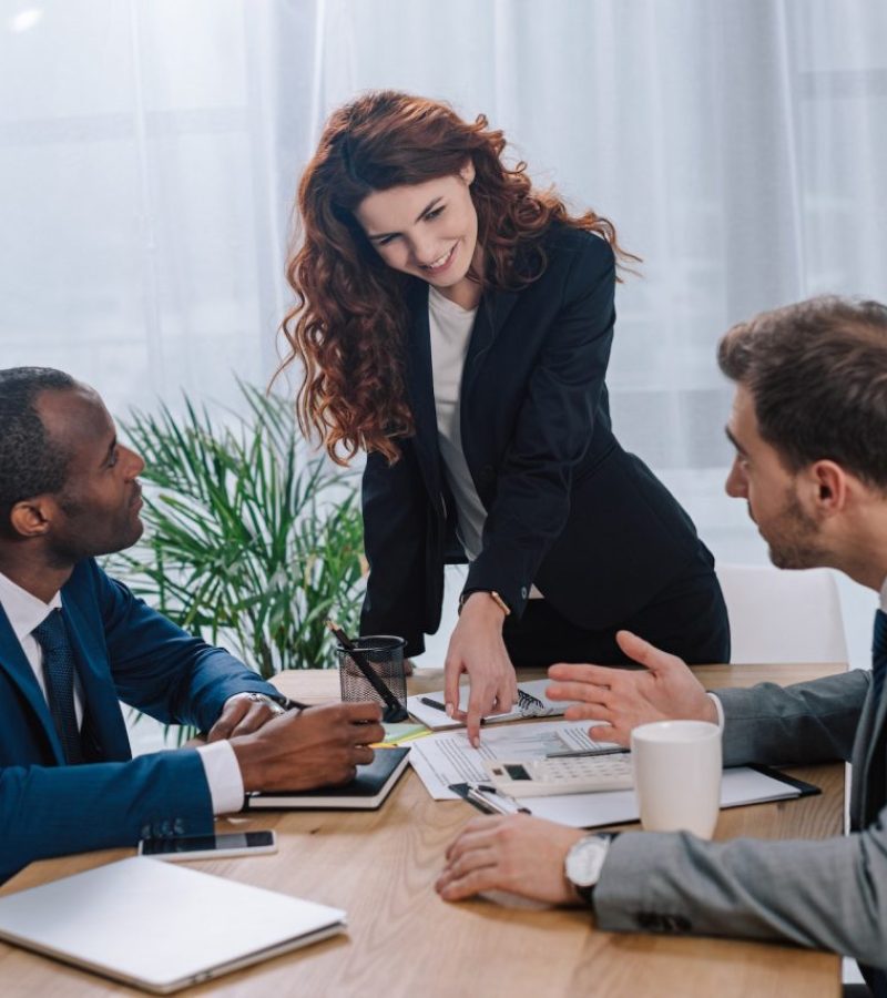 estate-broker-showing-documents-to-clients.jpg
