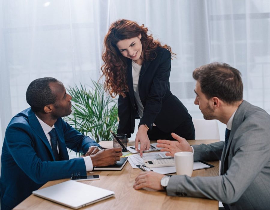estate-broker-showing-documents-to-clients.jpg